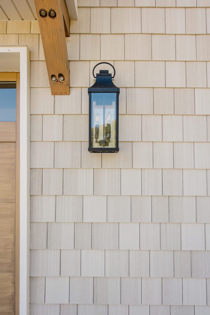 Exterior view of the Campbell Project, a custom home built in Utah with warm stone and timeless architecture