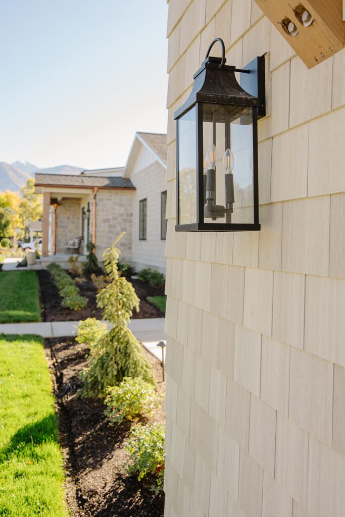Exterior view of the Campbell Project, a custom home built in Utah with warm stone and timeless architecture
