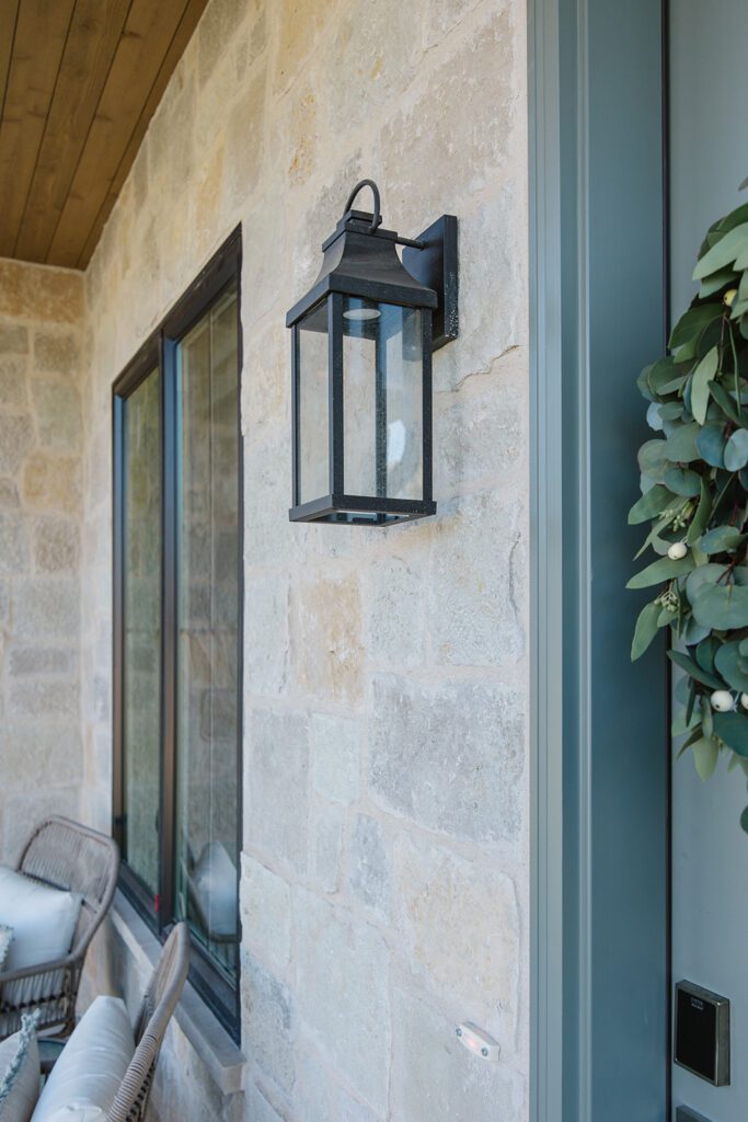 Exterior view of the Campbell Project, a custom home built in Utah with warm stone and timeless architecture