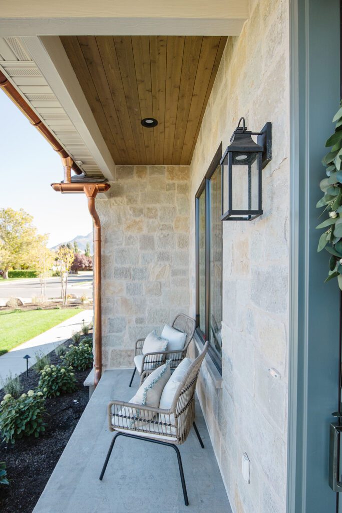 Exterior view of the Campbell Project, a custom home built in Utah with warm stone and timeless architecture