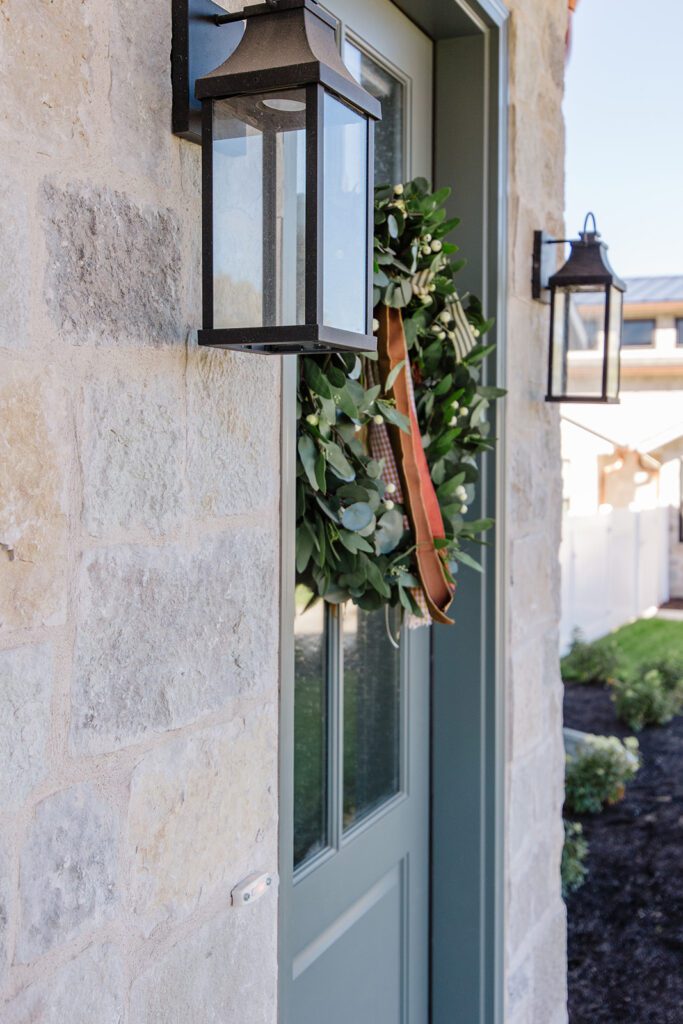 Exterior view of the Campbell Project, a custom home built in Utah with warm stone and timeless architecture