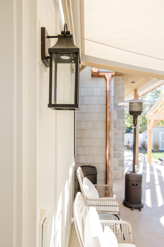 Driveway and entryway of the Campbell custom home built in Utah showcasing natural textures and modern design.