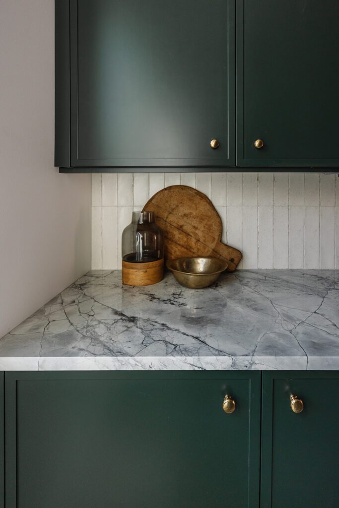 Organized butler’s pantry with prep space and open storage in Alpine Utah custom studio build