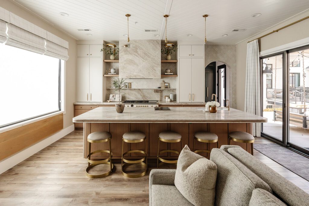 Luxury chef’s kitchen with large island and mixed textures in The Recipe Critic’s Alpine studio