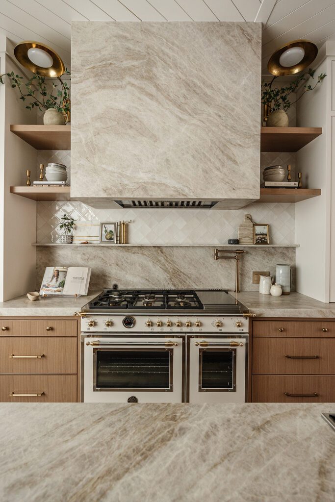 Luxury chef’s kitchen with large island and mixed textures in The Recipe Critic’s Alpine studio